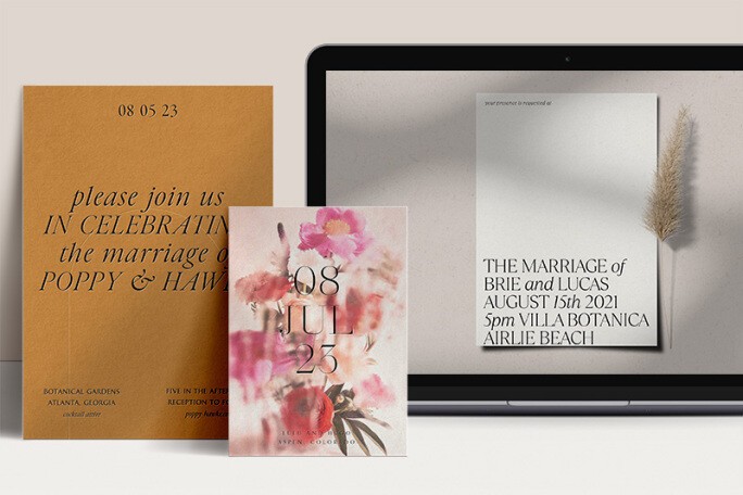 An orange printed wedding invitation, a floral printed wedding invitation and a laptop screen showing an image of a white online wedding invite