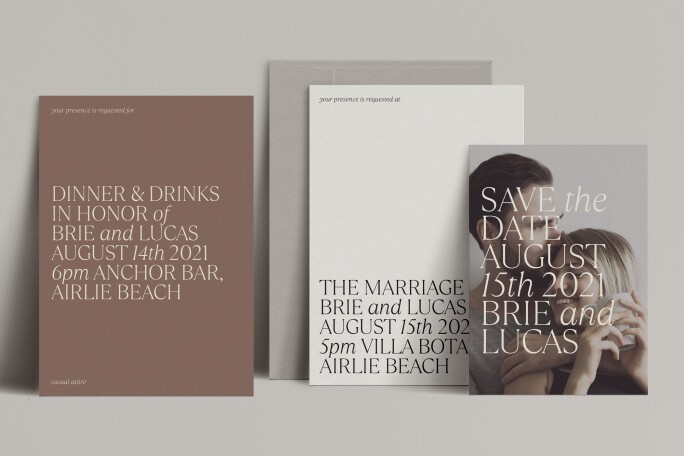 A collection of neutral toned wedding stationery in various sizes